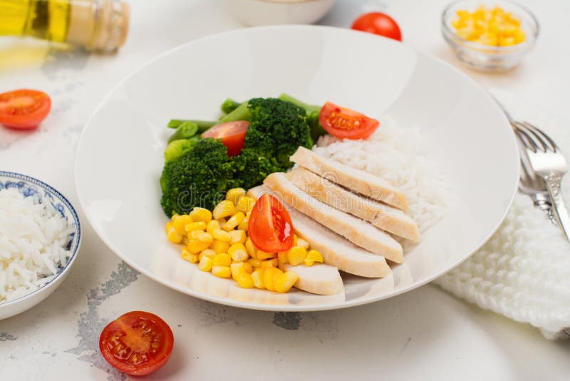 Balanced meal or diet concept. Chicken with rice and vegetables. Balanced meal or diet concept. Chicken with rice and vegetables