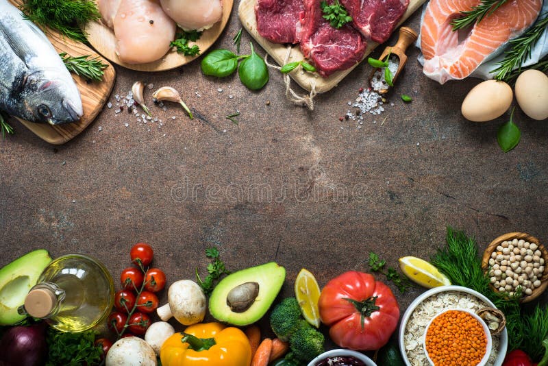 Balanced diet food background. Organic food for healthy nutrition. Meat fish beans and vegetables. Top view copy space on stone table. Balanced diet food background. Organic food for healthy nutrition. Meat fish beans and vegetables. Top view copy space on stone table.