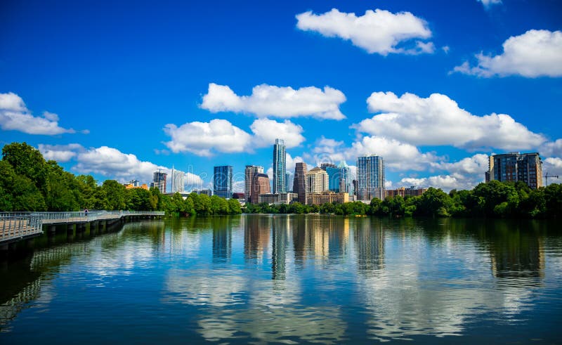 Austin Texas Riverside Pedestrian Bridge Town Lake Reflections on nice Summy Day Austin Texas Colorful Towers and Condominiums Cityscape Skyline from pedestrian bridge along colorado river. Austin Texas Riverside Pedestrian Bridge Town Lake Reflections on nice Summy Day Austin Texas Colorful Towers and Condominiums Cityscape Skyline from pedestrian bridge along colorado river