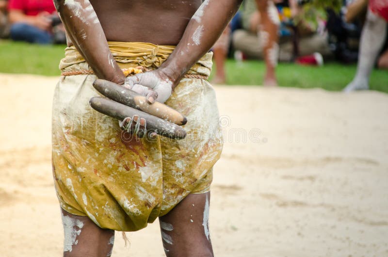 Australian aboriginal people holding Traditional Wood Claves percussion instruments. stock photos Australian aboriginal people holding Traditional Wood Claves percussion instruments. stock photos