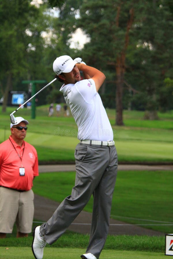 Pro golfer Jason Day of Australia watches his ball hit the fairway after making a drive on the green at the country club golf event. Pro golfer Jason Day of Australia watches his ball hit the fairway after making a drive on the green at the country club golf event.