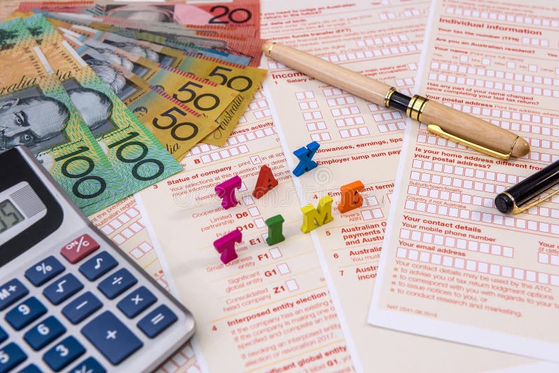 Australian Tax Form with Pen, Calculator and Australian Dollars Stock