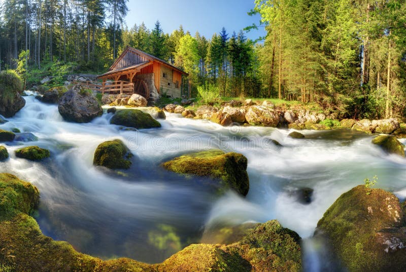 Austria panorama landscape with waterfall and watermill near Sal