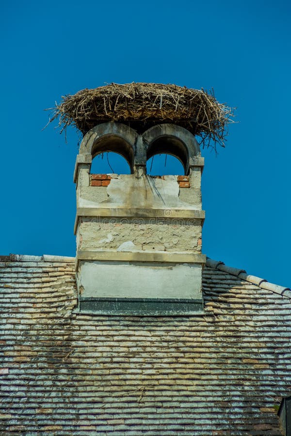 A stork's nest on a achornstein in rust. burgenland, austria. A stork's nest on a achornstein in rust. burgenland, austria