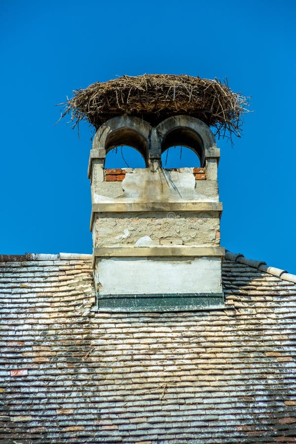 A stork's nest on a achornstein in rust. burgenland, austria. A stork's nest on a achornstein in rust. burgenland, austria