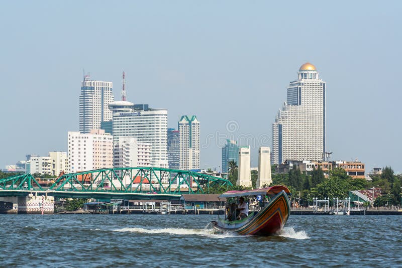 Authentic Boats and Modern Ships Floating by the River on Background of