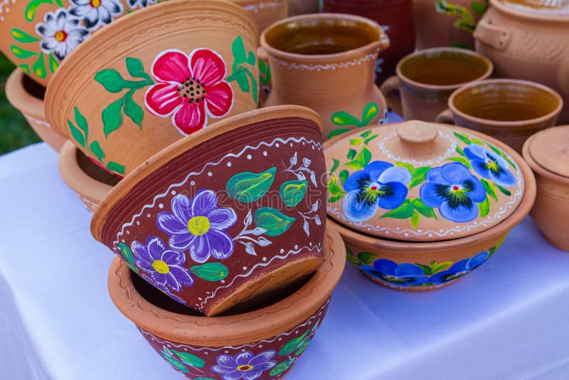 authentic handmade ceramic clay pots and bowls, sides and lid handpainted with floral blue violet pattern