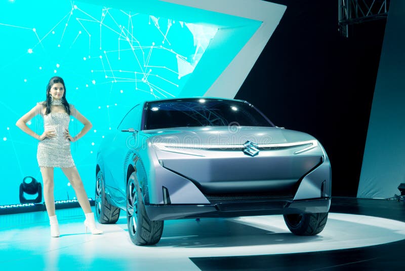 Auto Expo 2020, Greater Noida, India. GREATER NOIDA, INDIA - FEBRUARY 7, 2020: A model poses with Maruti Suzuki Futuro-e concept SUV on display at Auto Expo 2020 stock photo Auto Expo 2020, Greater Noida, India. GREATER NOIDA, INDIA - FEBRUARY 7, 2020: A model poses with Maruti Suzuki Futuro-e concept SUV on display at Auto Expo 2020 stock photo