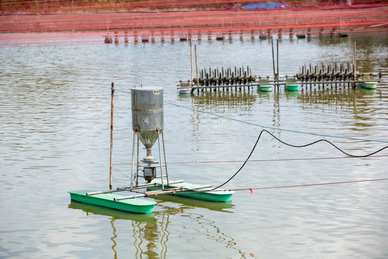 Auto Feeder Machine Floating on the Aquaculture Pond. Autometic Feeder ...