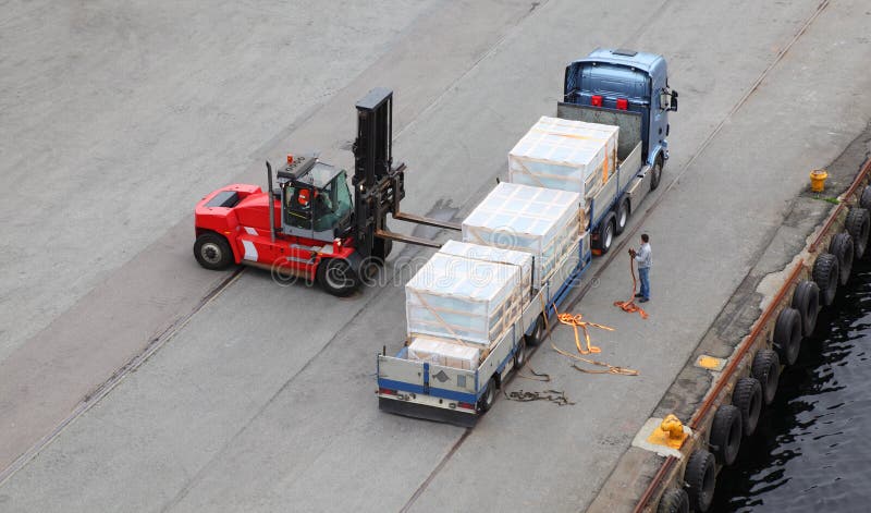 Auto-loader unload truck, labourer help