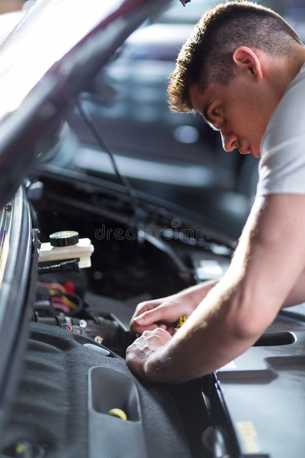 Auto mechanic fixing car stock photography