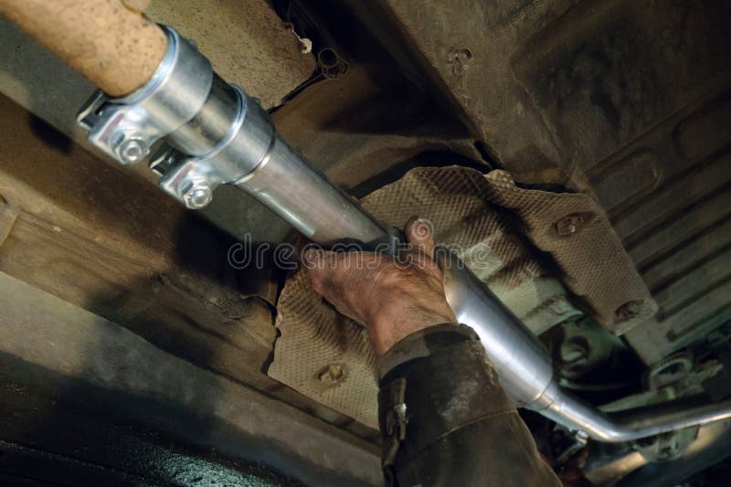 Auto Mechanic Installs a New Car Exhaust Pipe Stock Photo Image of