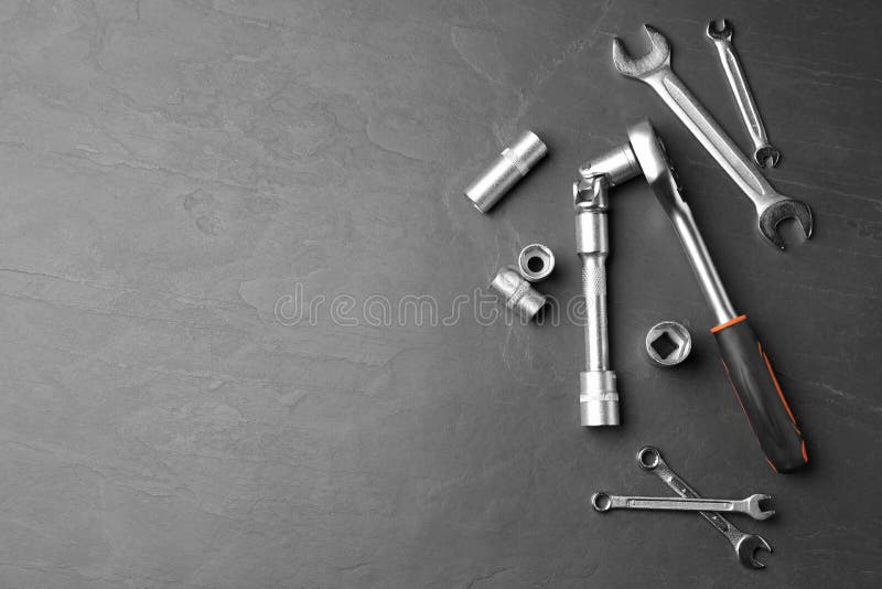 Auto Mechanic`s Tools on Grey Background, Flat Lay. Space for Text