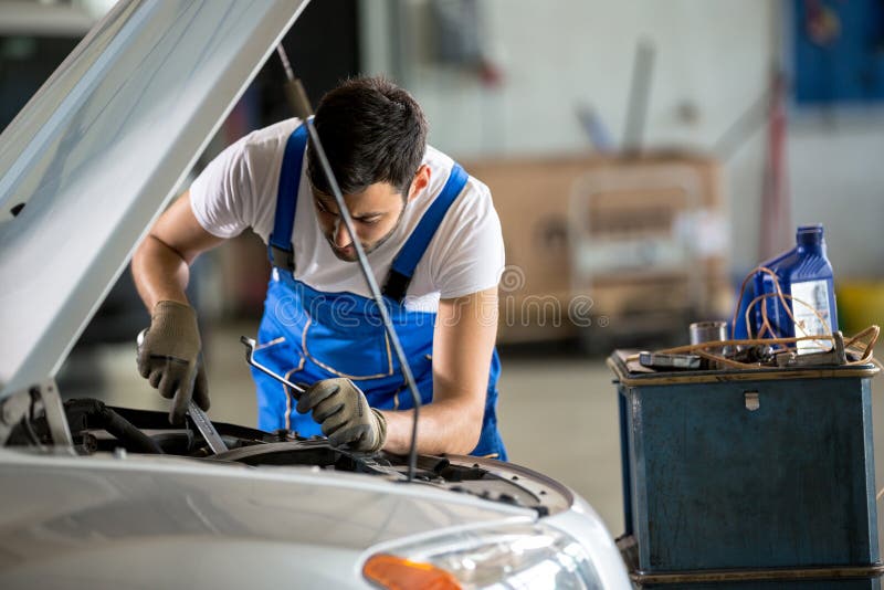 Auto Mechanic Working Under the Hood Stock Photo Image of repairing