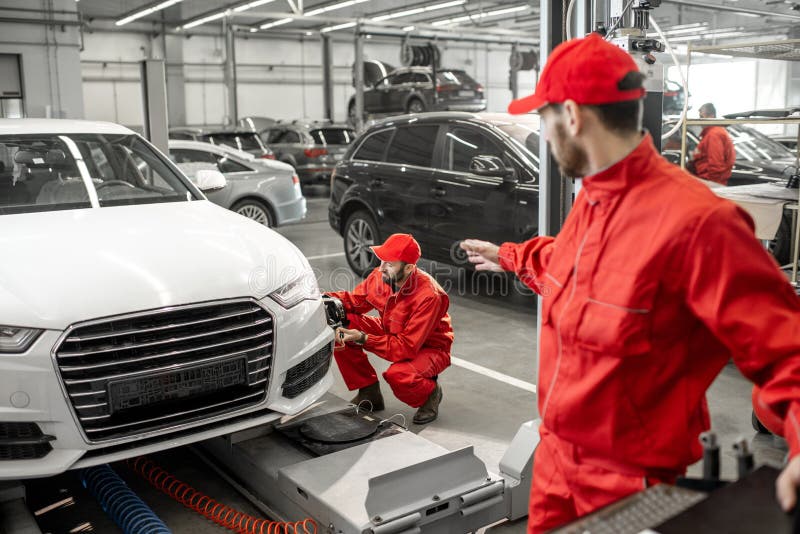 Auto Mechanics Serving Luxury Car at the Car Service Stock Image