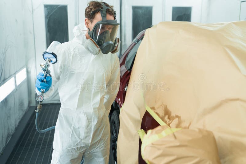Auto Painter with Spray Gun in Car Painting Booth. Stock Image Image