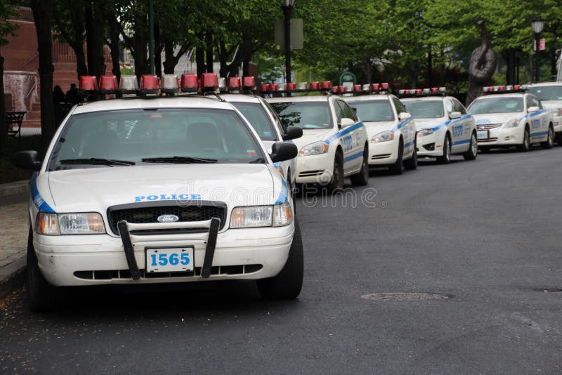 Rows of New York police cars parked near Battery park, downtown Manhattan Image taken 4/27/12. Rows of New York police cars parked near Battery park, downtown Manhattan Image taken 4/27/12