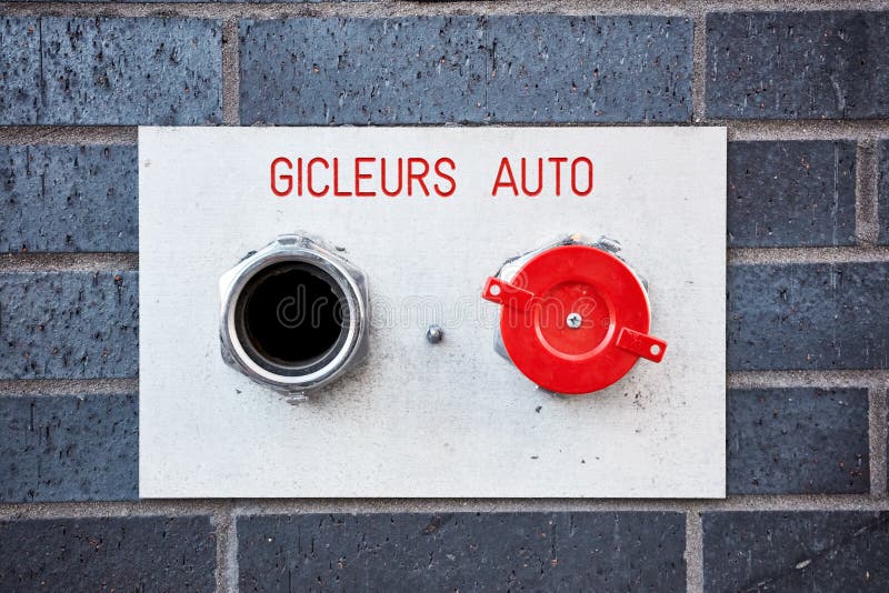 Auto sprinkler gicleurs auto fire hydrant system on a brick wall stock image