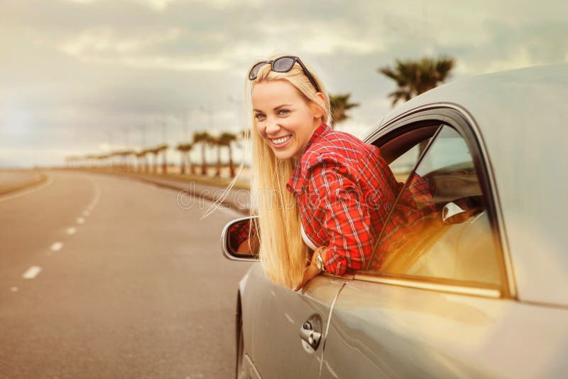 Young woman auto traveler on the highway. Young woman auto traveler on the highway