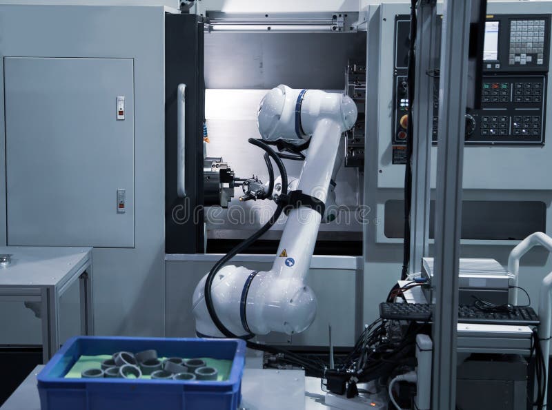 Robot Loading Workpiece To CNC Machine Stock Photo Image of metal