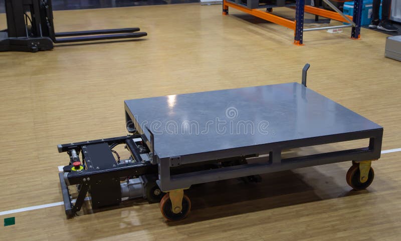 Automated guided vehicle AGV carry cardboard in modern warehouse