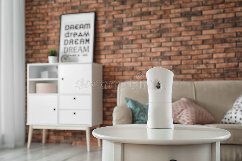 Automatic air freshener on table stock photo Automatic air freshener on table stock photo