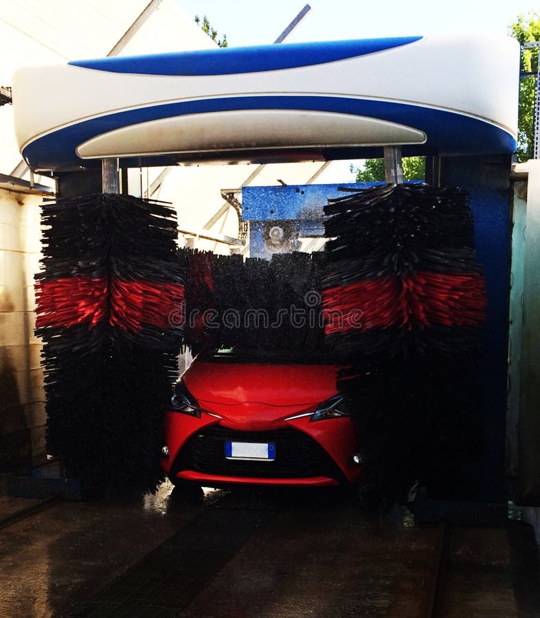 Automatic Car Wash in Action, Washing Process on a Red Car Stock Image Image of care