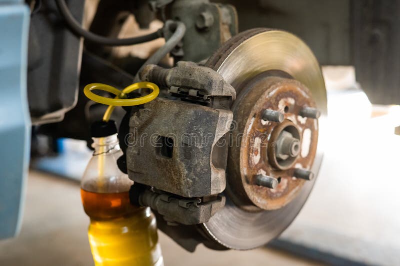 Automatic Change of Brake Fluid in a Car Service. Stock Photo Image