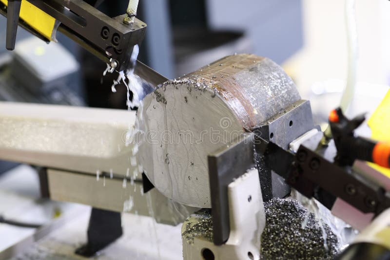 The Operation Of Band Saw Machine Cutting The Metal Rod 