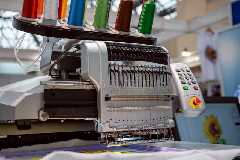 Automatic Industrial Sewing Machine for Stitch by Digital Pattern. Modern Textile Industry Stock