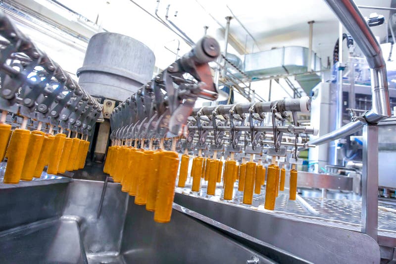 Automatic production line of fruit ice cream royalty free stock images