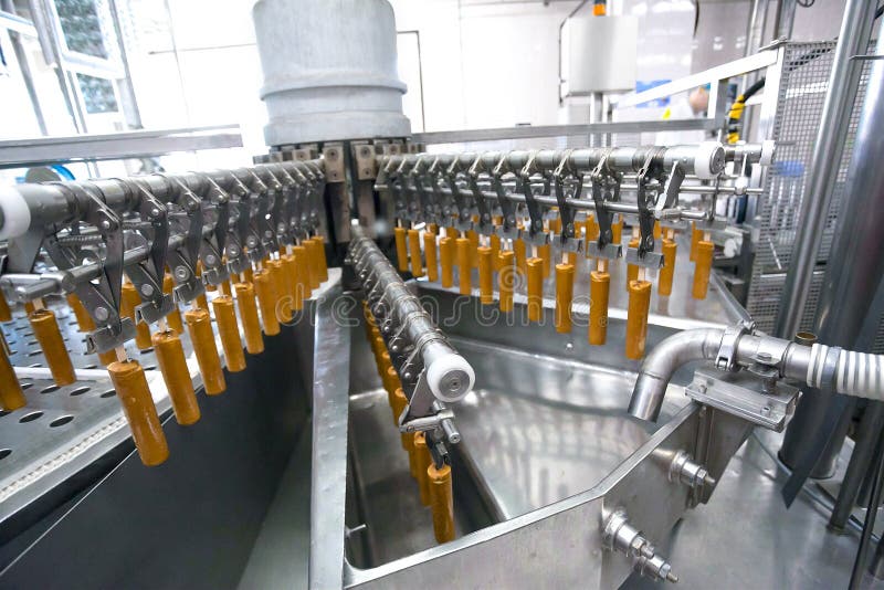 Automatic production line of fruit ice cream stock images