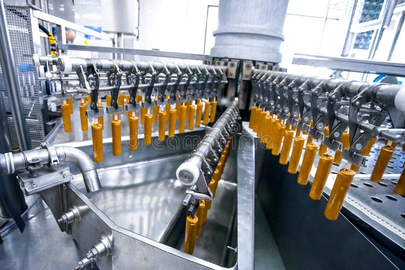 Automatic production line of fruit ice cream royalty free stock image