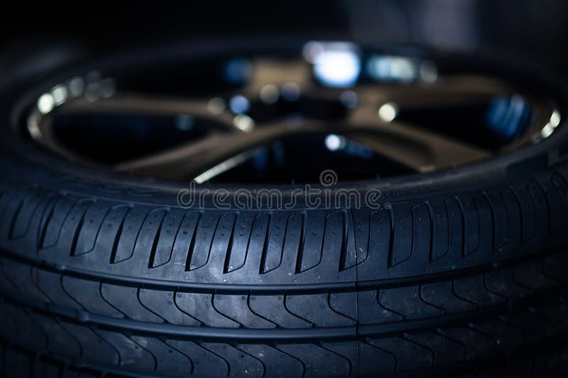 Automobile Tire Tread with a Depth and Light in the Darkness Stock