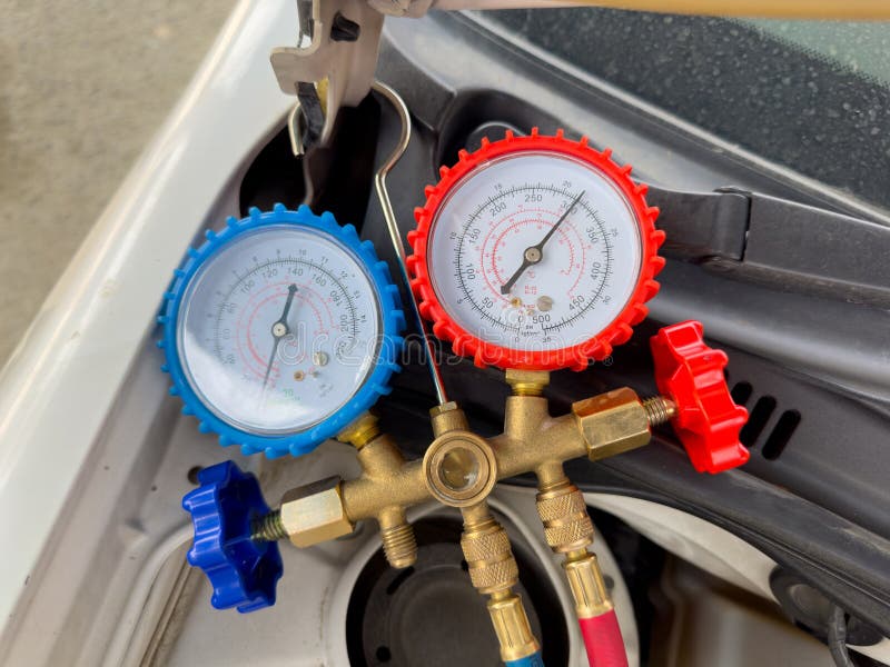 Automotive AC Pressure Gauge in Use Checking Vehicle Cooling System