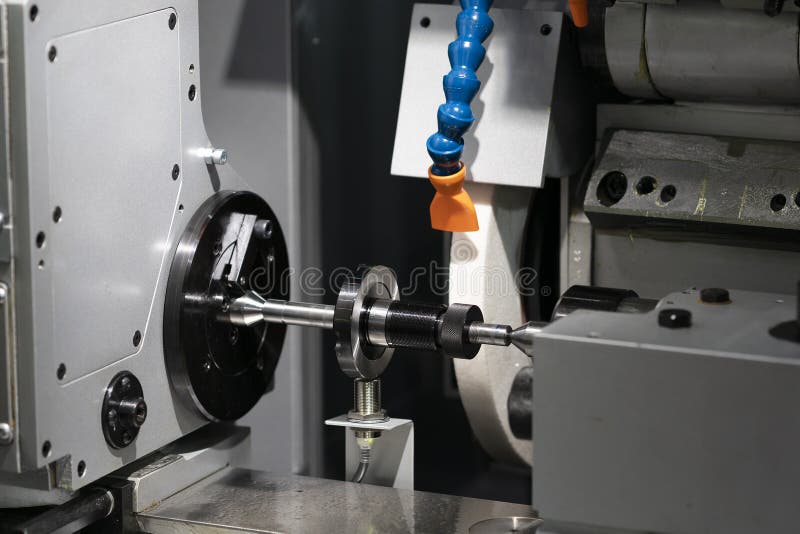 Automotive cnc lathe and cnc grinding part royalty free stock photos
