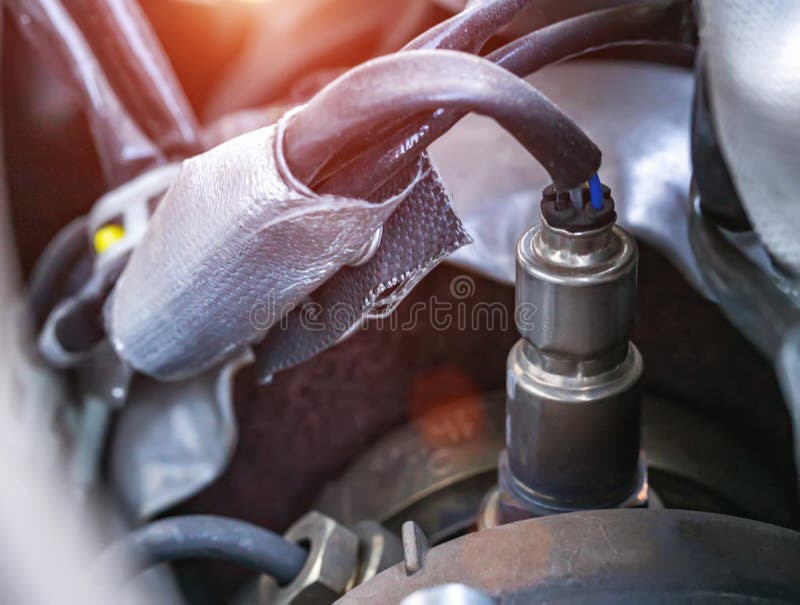 Automotive sensor lambda probe in a diesel engine. Measuring oxygen content in car exhaust gases, macro royalty free stock images