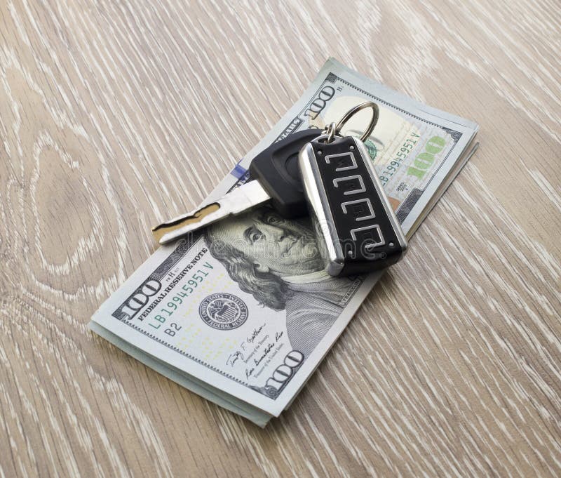Autosleutels en dollars Kopen, die een autobankbiljet verkopen stock foto Autosleutels en dollars Kopen, die een autobankbiljet verkopen stock foto