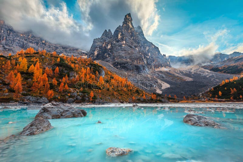 Autumn alpine landscape with turquoise glacier lake, Sorapis, Dolomites, Italy