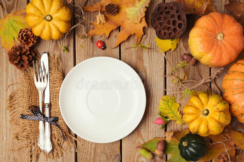 Autumn Background with Plate, Fall Leaves and Pumpkin Over Wooden Table ...