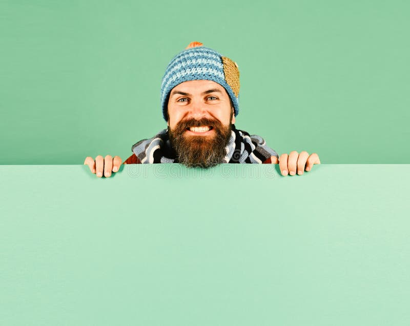 Autumn and cold weather concept. Hipster with beard and happy face wears warm clothes. October and November sale idea royalty free stock photos Autumn and cold weather concept. Hipster with beard and happy face wears warm clothes. October and November sale idea royalty free stock photos