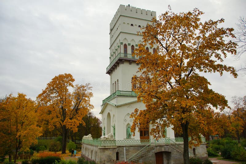 Walking in the autumn evening in the Alexander Park. Autumn evening in the Alexander Park in Tsarskoe Selo, the White Tower royalty free stock image Walking in the autumn evening in the Alexander Park. Autumn evening in the Alexander Park in Tsarskoe Selo, the White Tower royalty free stock image