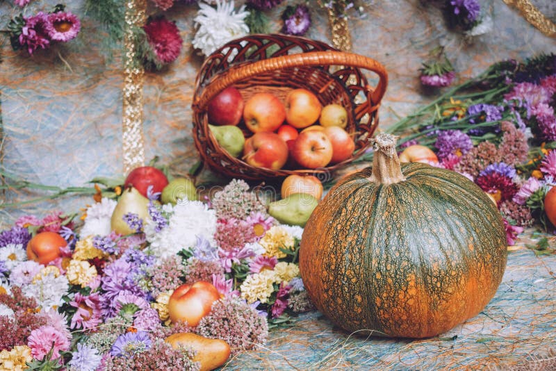 Autumn fall seasonal decorations with pumpkins, fresh fruits in basket, berries and flowers. Autumn harvest, farm market, sale stock image Autumn fall seasonal decorations with pumpkins, fresh fruits in basket, berries and flowers. Autumn harvest, farm market, sale stock image