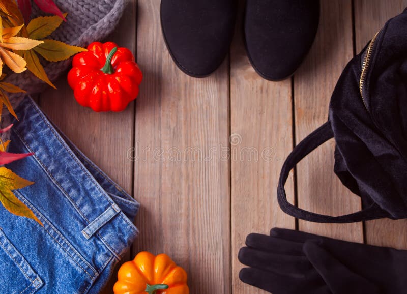 Autumn female outfit. Set of clothes, shoes and accessories on the wooden table. Top view. Copy space royalty free stock images Autumn female outfit. Set of clothes, shoes and accessories on the wooden table. Top view. Copy space royalty free stock images