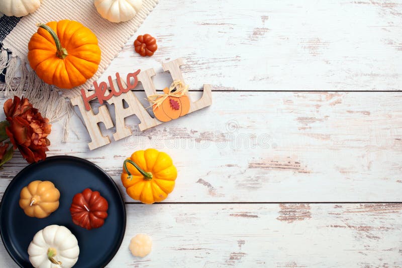 Autumn flat lay composition with pumpkins and Hello Fall sign stock photography