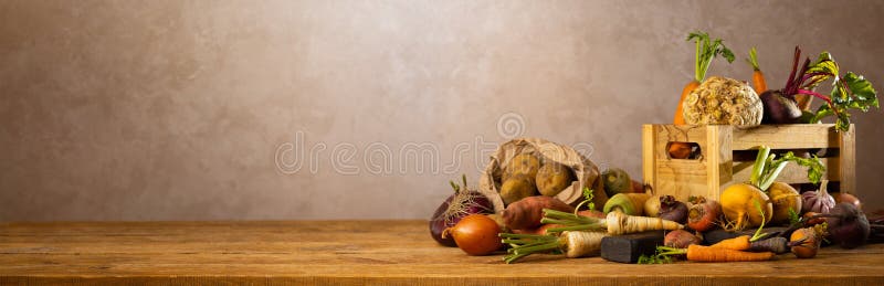 Autumn harvest of root vegetables. Still life of food on wooden table. Concept healthy food