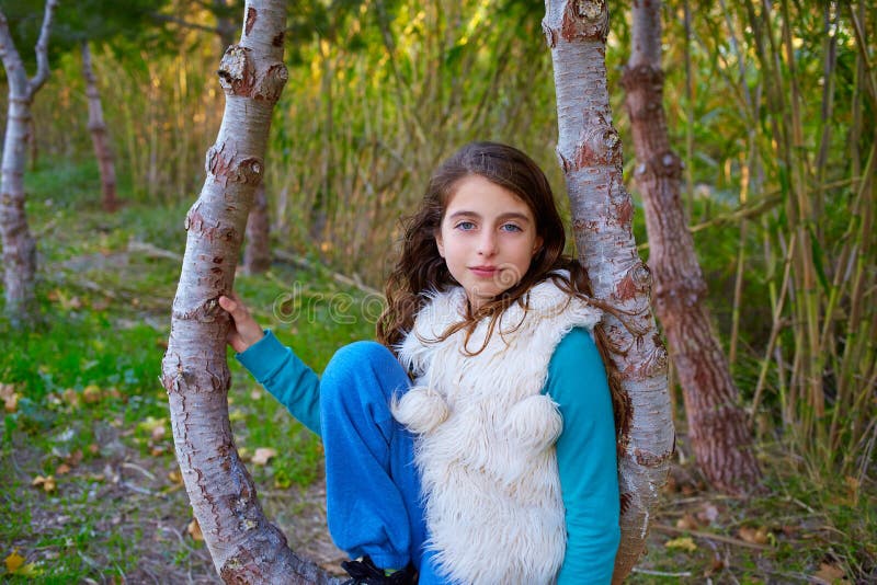 Autumn kid girl relaxed in forest with green canes stock image Autumn kid girl relaxed in forest with green canes stock image