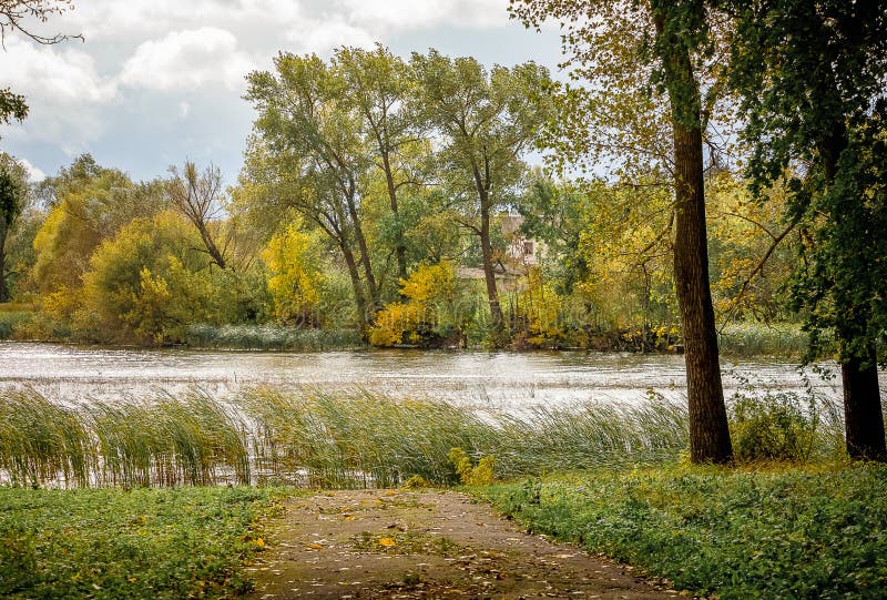 Autumn Landscape: Park overlooking the river and the path to riv