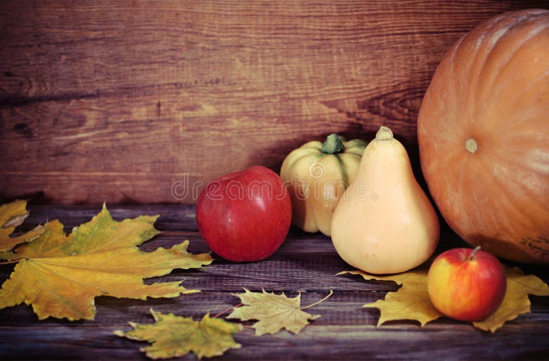 Autumn leaves, apples and pumpkins