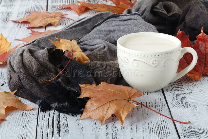 Autumn leaves and black coffee composition. coffee cup at weathered rustic wood background. Fall hot drinks concept royalty free stock image Autumn leaves and black coffee composition. coffee cup at weathered rustic wood background. Fall hot drinks concept royalty free stock image